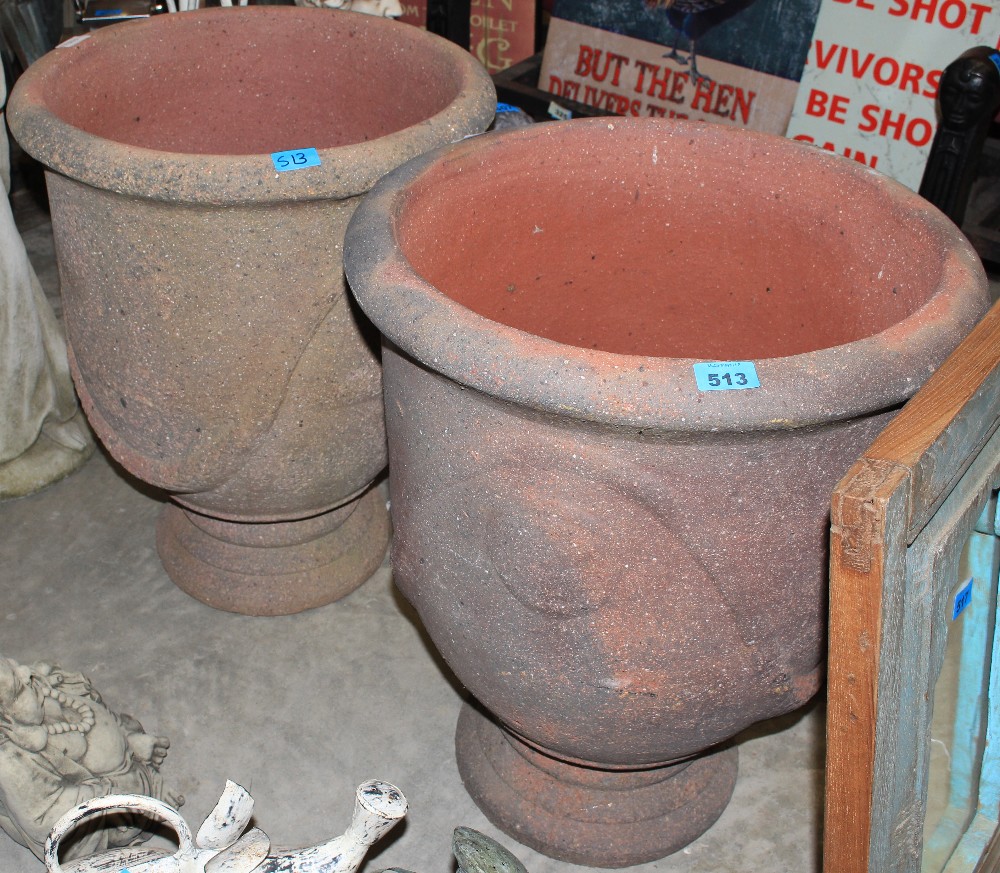 Two terracotta urns