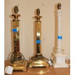 A pair of brass table lamps and another