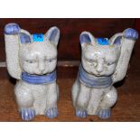 A pair of Oriental style ceramic cat figures