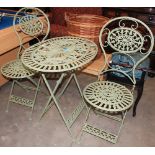 A three piece metal patio set