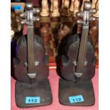 A pair of bronze double bass bookends