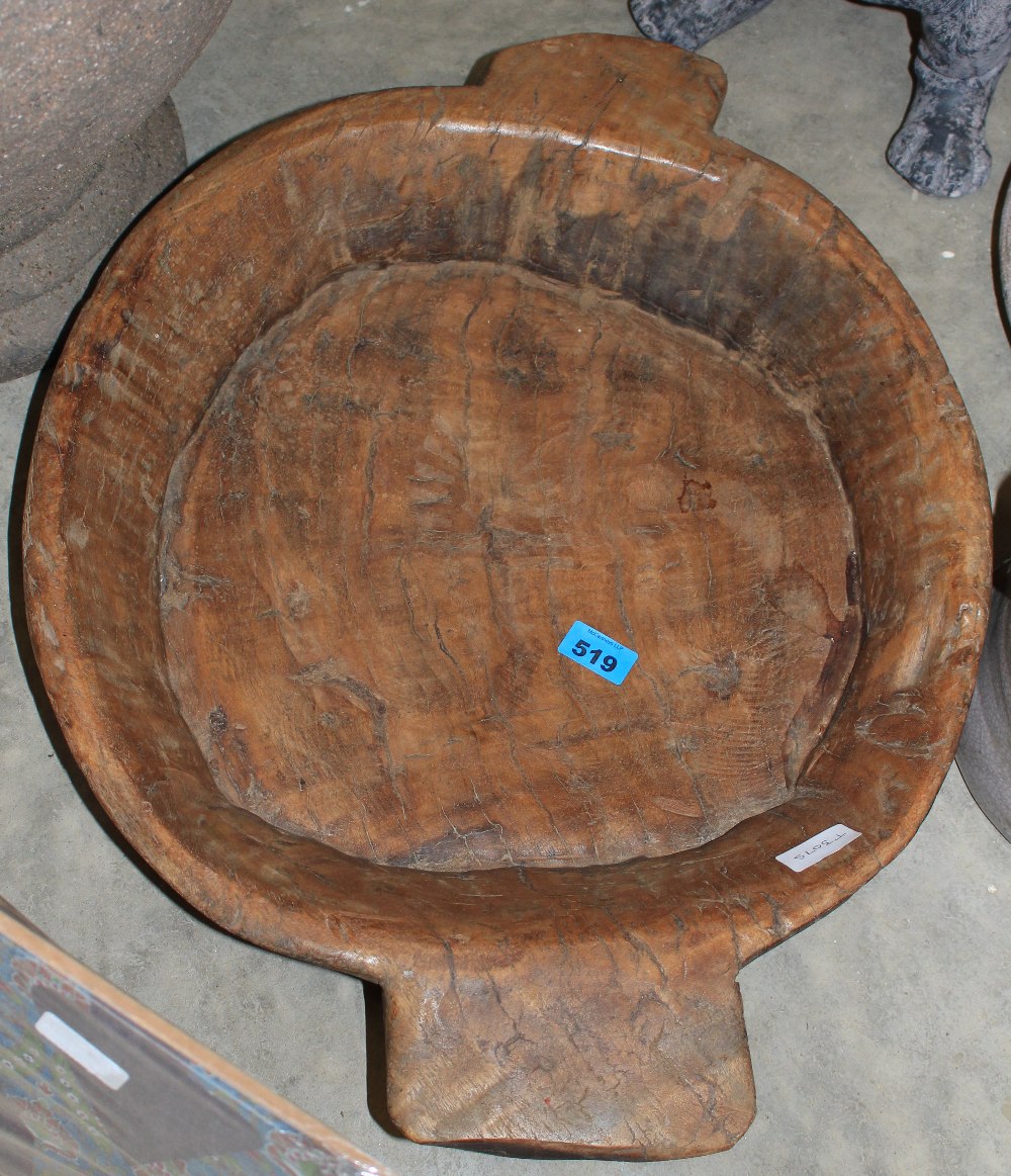 A primitive wood dough bowl