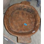 A primitive wood dough bowl