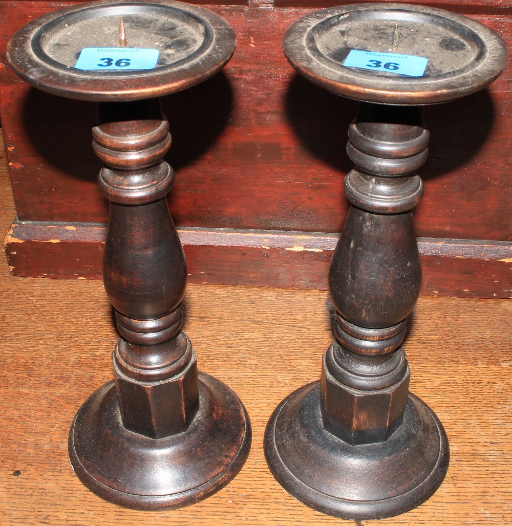 A pair of treen pricket sticks