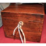 A 19th Century rosewood tea caddy with mother-of-pearl escutcheon and original key. 4 ¾" wide