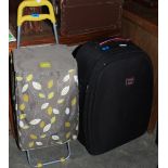 A shopping trolley and two cases