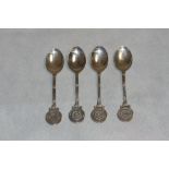 Golf. A set of four silver teaspoons, the coin form terminals with Tudor rose, crossed clubs and SGC