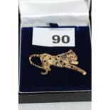 A 9ct leopard brooch, set with sapphires, diamonds and rubies