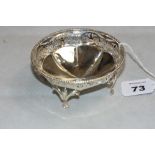 73. A silver bonbon bowl with beaded rim and pierced border. 4 ¼" diam. Birmingham 1923