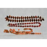 Three necklaces of glass amber coloured beads (one requires re-stringing)