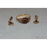 A garnet cluster ring. In gold marked 375, size O; together with a pair of garnet set earrings in