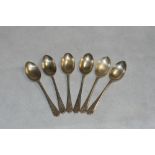Golf. A set of six silver teaspoons with crossed clubs and ball decoration