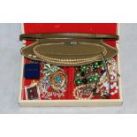 A box of costume jewellery to include a gentleman's wristwatch, simulated pearls, silver locket