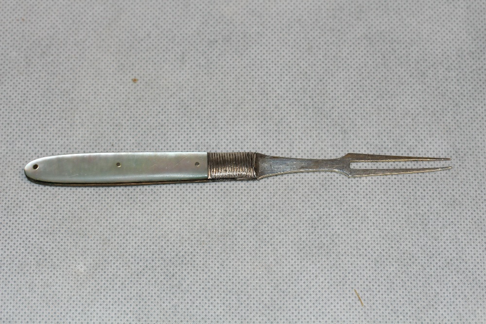 A Georgian silver and mother-of-pearl fruit fork