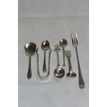 Silver smallware comprising a sugar bow, pickle fork and five spoons. 4ozs