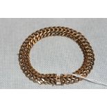 A gold linked bracelet, the spring clasp with safety clip. Continental. Apparently unmarked but