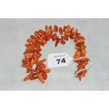 A necklace of irregularly shaped amber beads. 37g