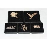 Five silver brooches