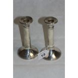 A pair of George V silver loaded candlesticks of plain form. 5 ½" high. Birmingham 1920 (Dents,