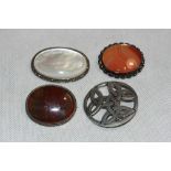 A moss agate brooch and three others