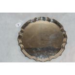 A George VI silver salver of shaped round form on volute feet. Sheffield 1946. 13 ½" diam.