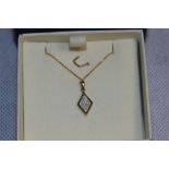 A Damas 'floating diamond' pendant. In gold marked 750