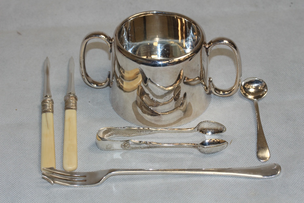 A quantity of silver plate to include a basting spoon, two bottle coasters etc.