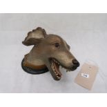 An Austrian cold painted terracotta hound's head. Stamped twice for Wilh. Andston, Helsingtors. c.