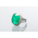 EMERALD AND DIAMOND CLUSTER RING
the central oval cut emerald approximately 8.