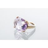 IMPRESSIVE AMETHYST DRESS RING
the large faceted oval cut amethyst measuring approximately 19.