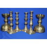 SIX BRASS CANDLESTICKS
including a pair of Post-Modernist style demishpere shaped examples,