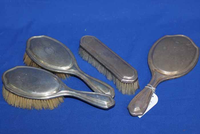 STERLING SILVER VANITY SET
attractive engine-turned design, comprising two hair brushes,