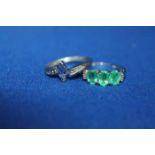 TWO DRESS RINGS
an emerald three stone and diamond;