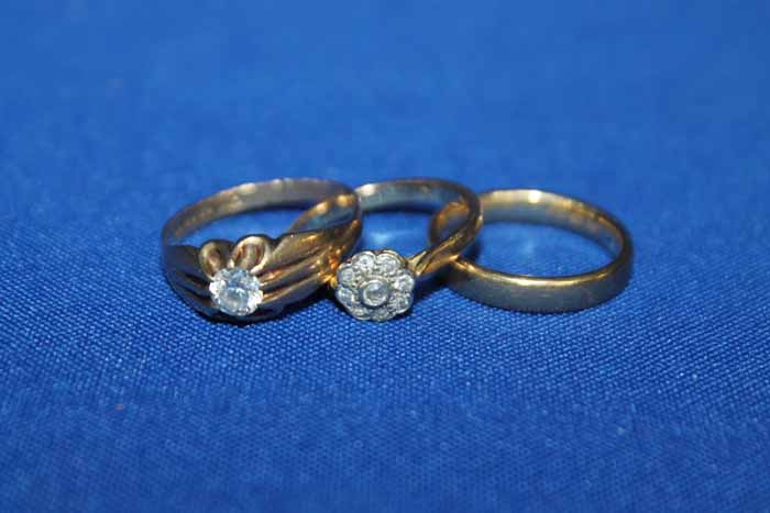 COLLECTION OF THREE NINE CARAT GOLD RINGS
one cluster ring,