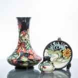 MODERN MOORCROFT GOURD SHAPED VASE
decorated with large flowerheads on a dark blue ground,