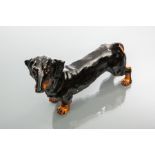 ROYAL DOULTON FIGURE OF A DACHSHUND
front right paw handpainted 'HN 1128',