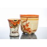 TWO CLARICE CLIFF BIZARRE WARE CERAMICS
comprising a rustic banded tall bowl with floral detail on