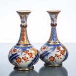 PAIR OF VICTORIAN MACINTYRE BURSLEM FLORAL BOTTLE VASES
decorated in the Imari palette,