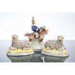 19TH CENTURY STAFFORDSHIRE FIGURE OF PUNCH
seated on a goat, on an oval base, 18.