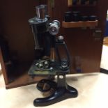 EARLY TWENTIETH CENTURY BRASS BINOCULAR MICROSCOPE
by Beck, London, ebonised finish,