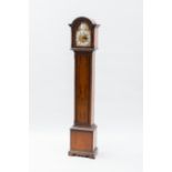 TWENTIETH CENTURY MAHOGANY GRANDMOTHER CLOCK
the unsigned eight day three train movement with