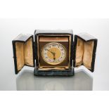 CHARMING BRASS ZENITH TRAVEL ALARM CLOCK
keyless wind movement striking on a bell,