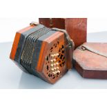 VICTORIAN WALNUT CONCERTINA
with fretted ends, leather thumb straps, thirty one natural bone keys,