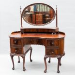 MAHOGANY KIDNEY SHAPED DRESSING TABLE OF GEORGE III DESIGN 
the raised back with oval bevelled