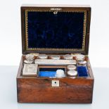 VICTORIAN ROSEWOOD OBLONG TRAVELLING DRESSING CASE 
the hinged cover revealing a fitted interior