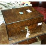 VICTORIAN WALNUT TRAVELLING DRESSING CASE
the hinged cover inset engraved mother of pearl plaquette,