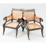 PAIR OF REGENCY-STYLE EBONISED AND GILTWOOD BERGERE ARMCHAIRS
with rush back and seat,