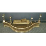 EARLY 19TH CENTURY PIERCED STEEL SERPENTINE FENDER
together with two tool racks that fit into the