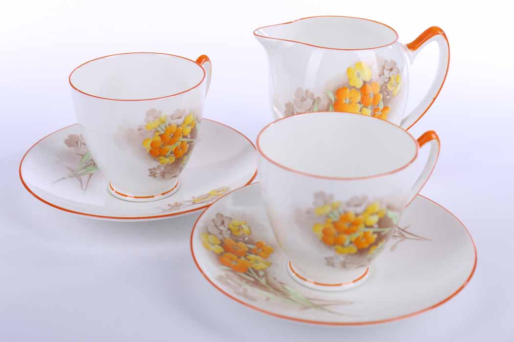 SHELLEY TEA SERVICE transfer decorated with yellow and orange pansies, comprising twelve cups,