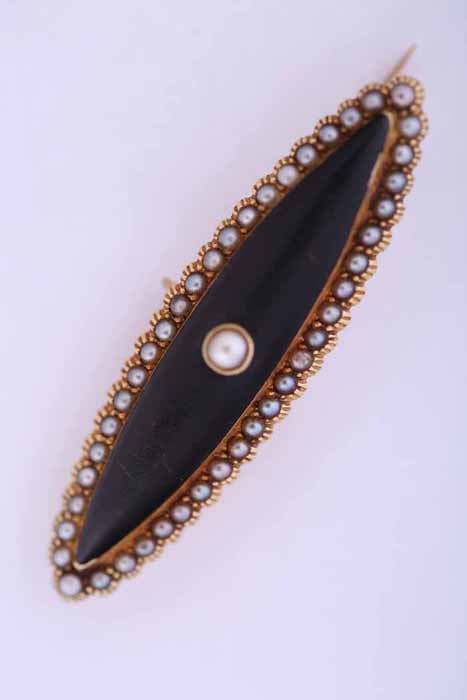 FIFTEEN CARAT GOLD VICTORIAN PEARL AND ENAMEL MOURNING BROOCH of marquise form,